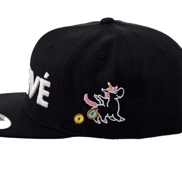 Side of Purvé Donut Stop snapback hat with an embroidered unicorn pooping donuts