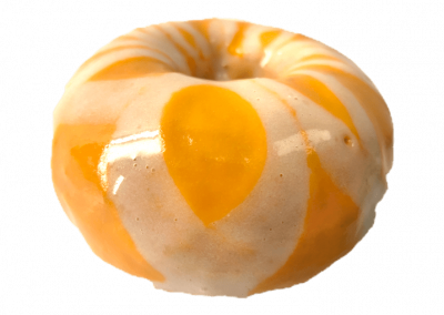 Orange glazed donut topped with cream cheese drizzle from Purvé Donut Stop Hawaii